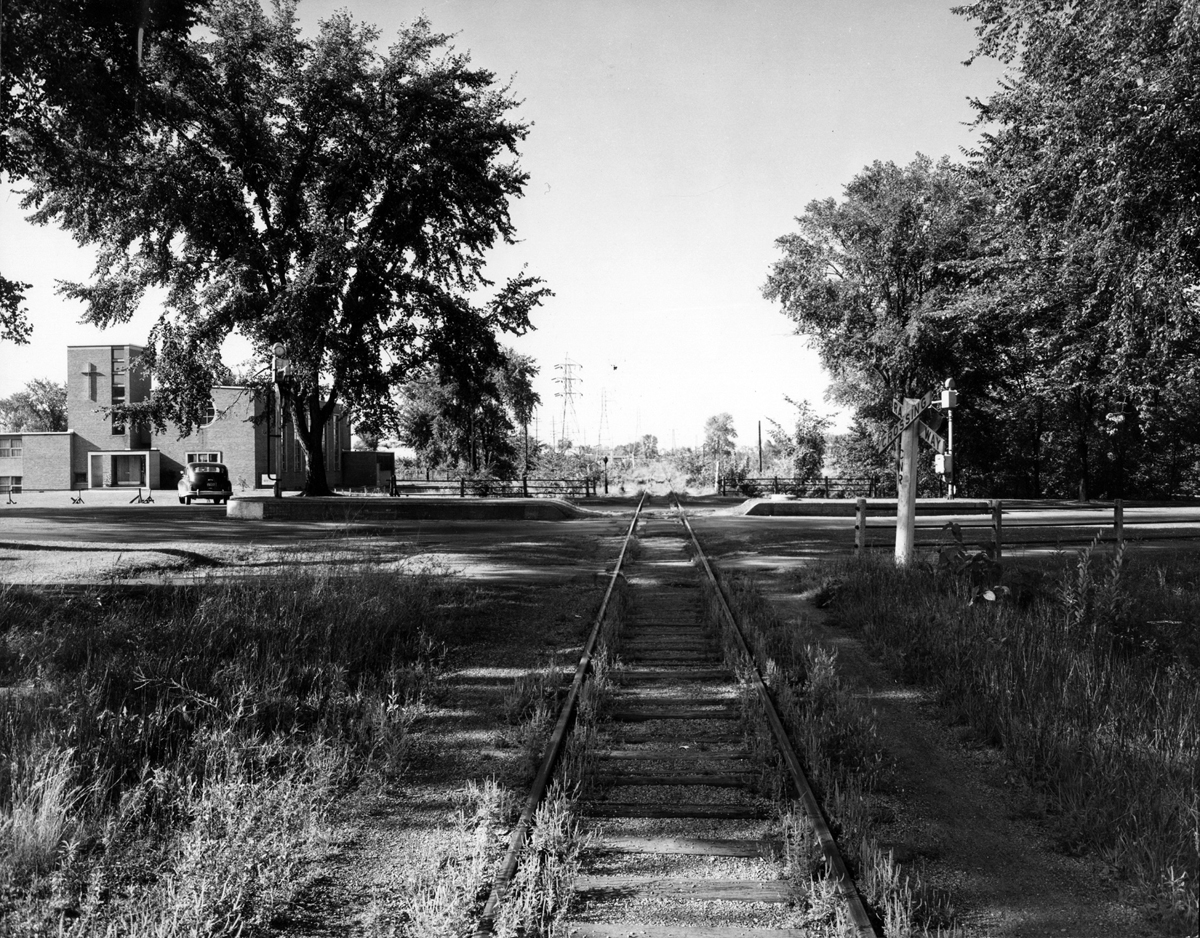 This was the scene in 1955 before the railway tracks were removed near Island Park. That’s the Kitchissippi United Church in the background. Photo courtesy of the City of Ottawa archives (CA-24213). Click image to enlarge.