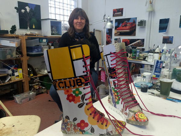 Patti Normand, shown here with the work of one of her favourite local artists, Alison Smith-Welsh. Photo by Andrea Stokes