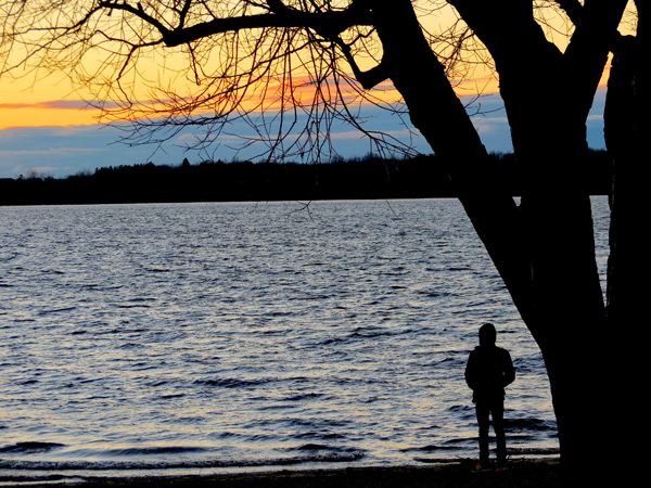 “This young teenager rode his bike down to the beach and watched the sunset. He had just come to Canada from Syria via Lebanon ¬– sponsored through a church group. He spoke little English but we were able to converse and he told me it was cold here,” says Nancy Mooney. Photo by Nancy Mooney.