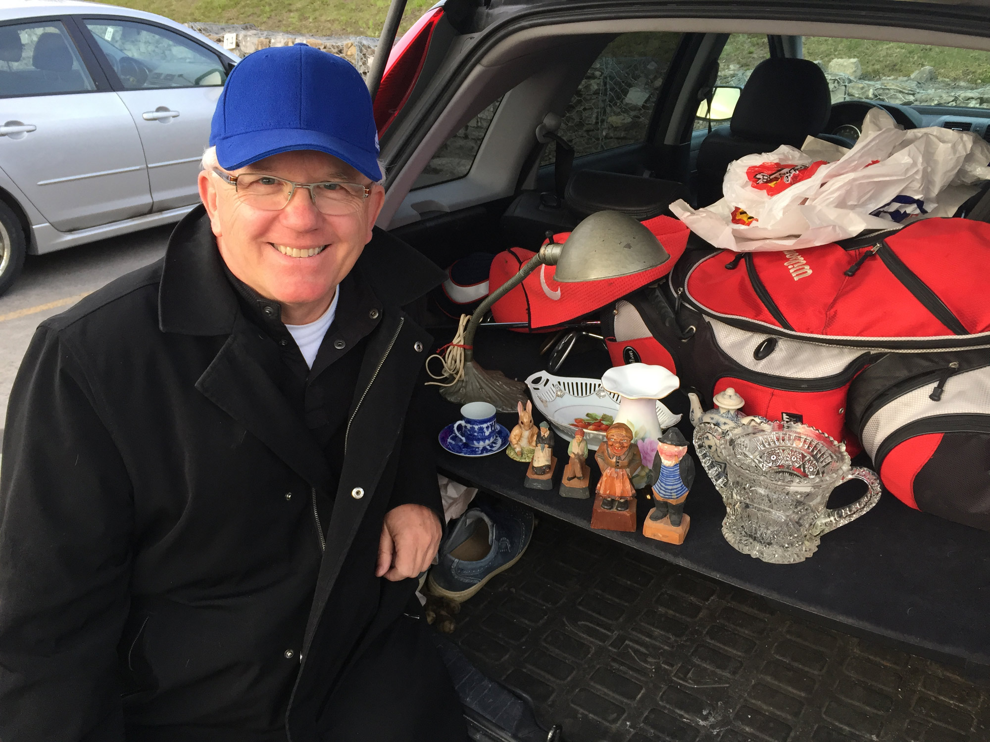 Shaun Markey with a few of his finds from the Kitchissippi United Church bazaar. Photo by Andrea Tomkins