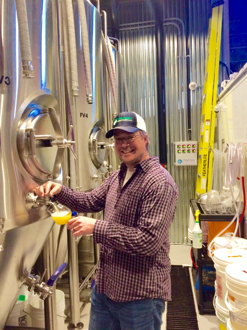 Tooth and Nail Brewing Company owner Matt Tweedy pours a fresh sample. Photo by Shauna McGinn