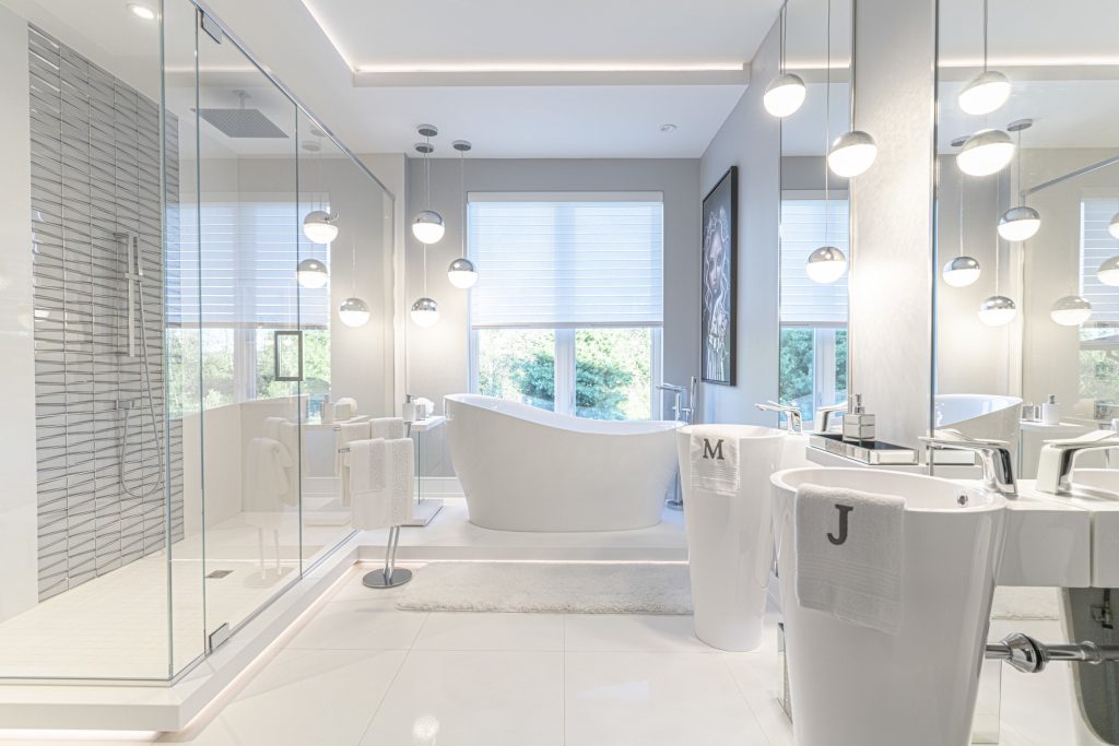 A very modern mostly white bathroom. 