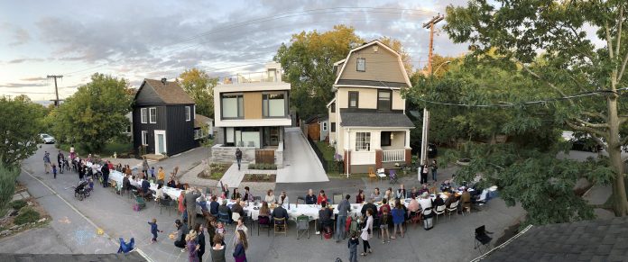 Neighbours gather on Winston Ave for a sit-down supper.