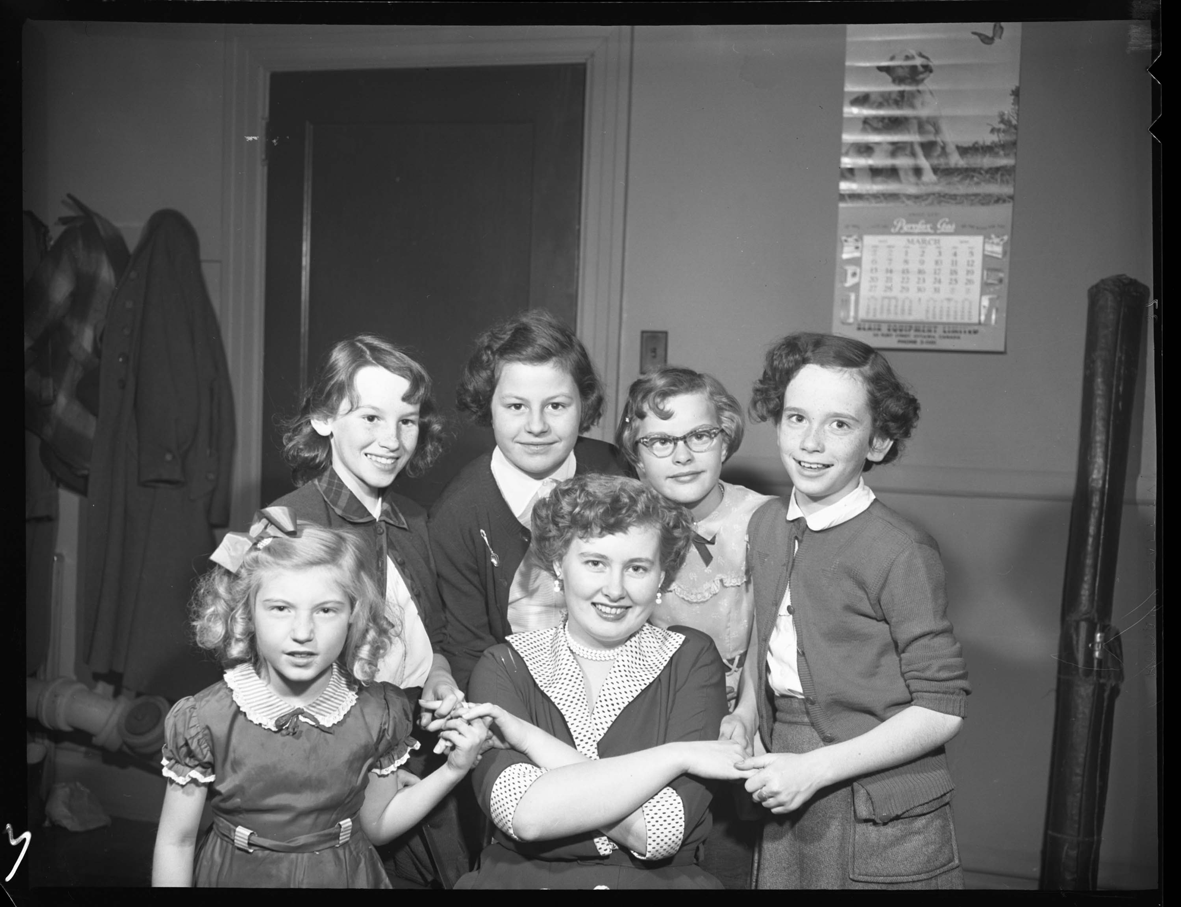 A group of girls get ready for a skating party at the Elmgrove outdoor arena in 1955.