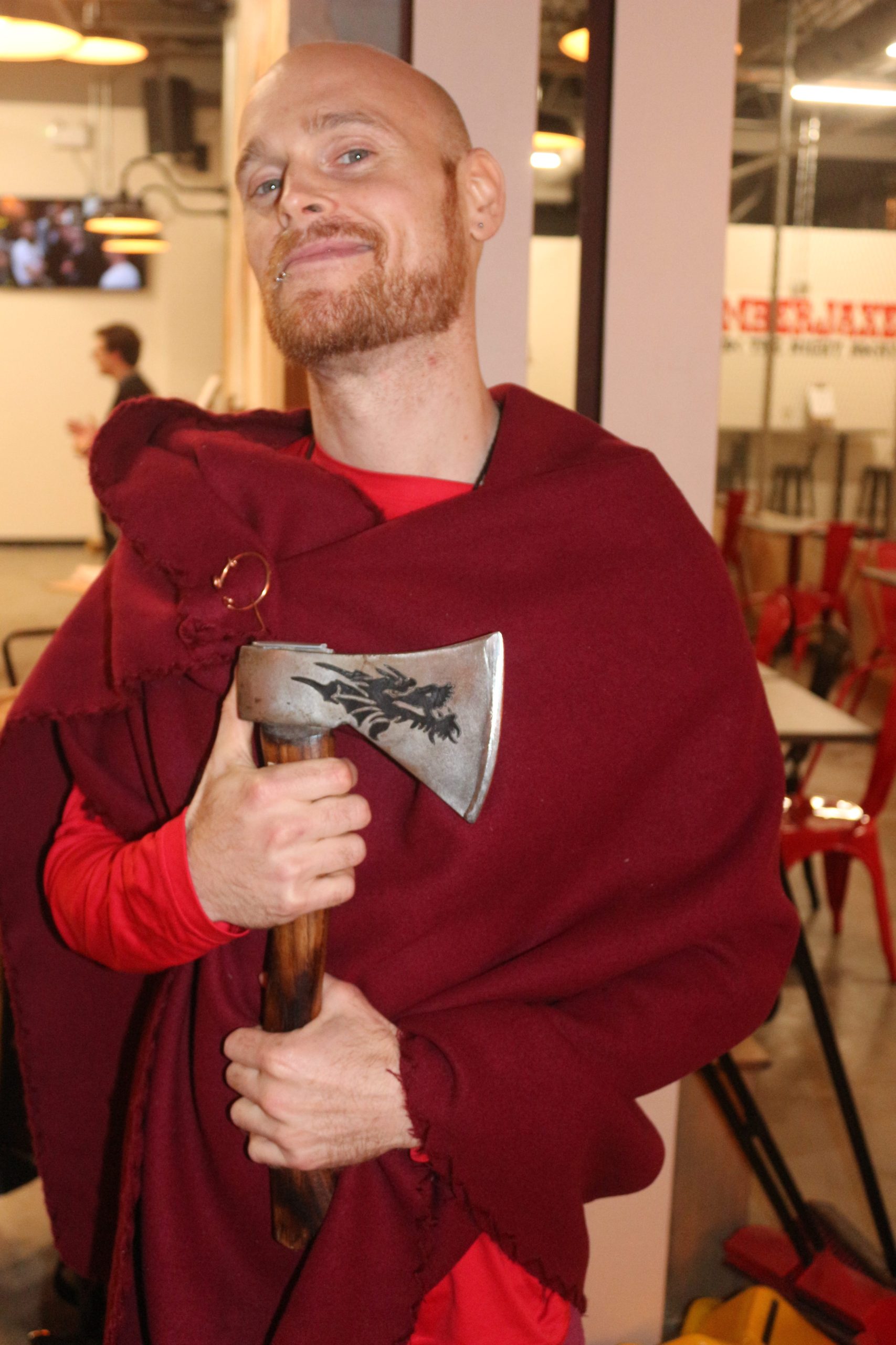 Sysafey Vennon, one of the staff at Lumberjaxe, poses with an axe.