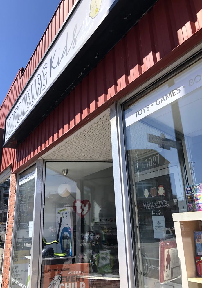 The side of Hintonburg Kids' storefront on a sunny day.