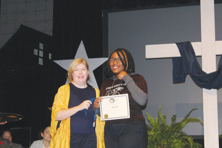 Art teacher Ms. Erin Feeney and Honour Roll recipient Victory Kaly. ?