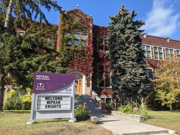 The outside of Nepean High School on a sunny day in fall|