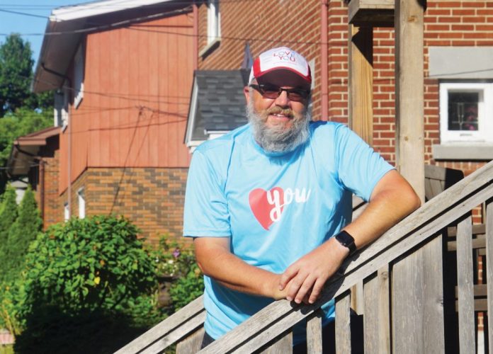 A photo of Marc Gagnon arriving at home in Hintonburg after his 24 hour walk for mental health.|A map of Marc Gagnon's 78 km loop in Ottawa.