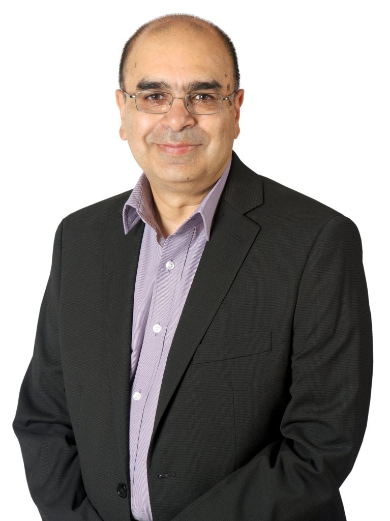 A headshot of Dr. Raj Bhatla against a white background