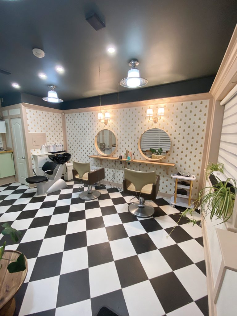 The inside of ApartMint Hair Studio in Hintonburg with a black and white checkered floor and white walls