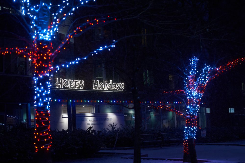 Dark blue and red lights light the Salvation Army Grace Manor in Kitchissippi.