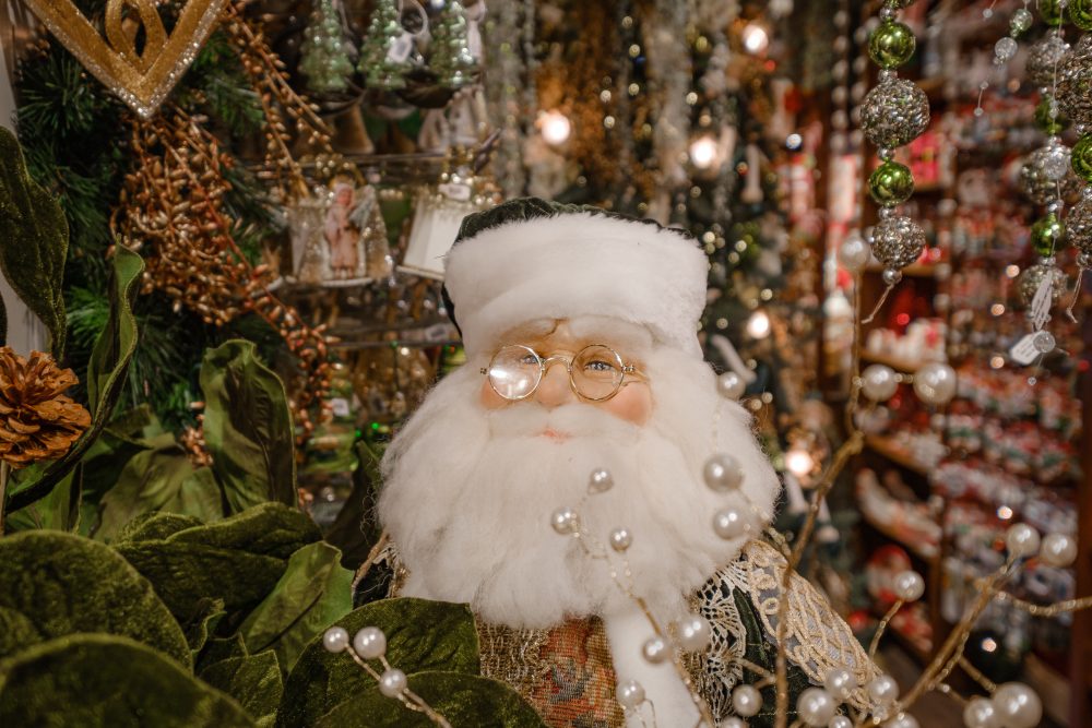 A Santa decoration wearing green.