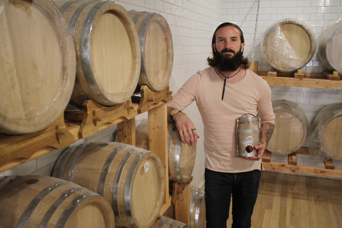 Wine Bottega manager Jonathan Percival imports grape juices from around the world and then ferments them on-site for his customers, producing a unique and consistent taste. Photo by Jacob Hoytema