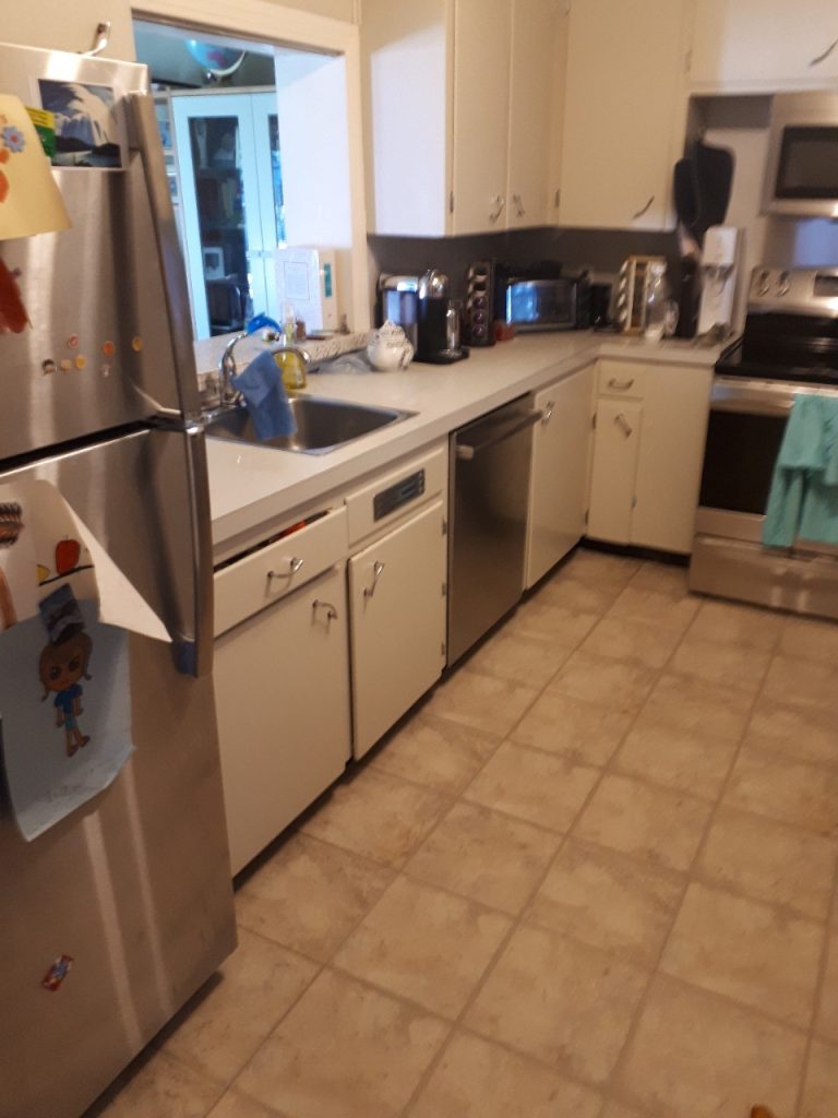 A picture of the kitchen pre-renovation with 1940s style