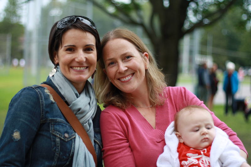 Friends Alecia O’Brien (left) and Amanda Taylor, holding son Graham (3 months), appreciate that the community event has appeal for kids and adults alike.