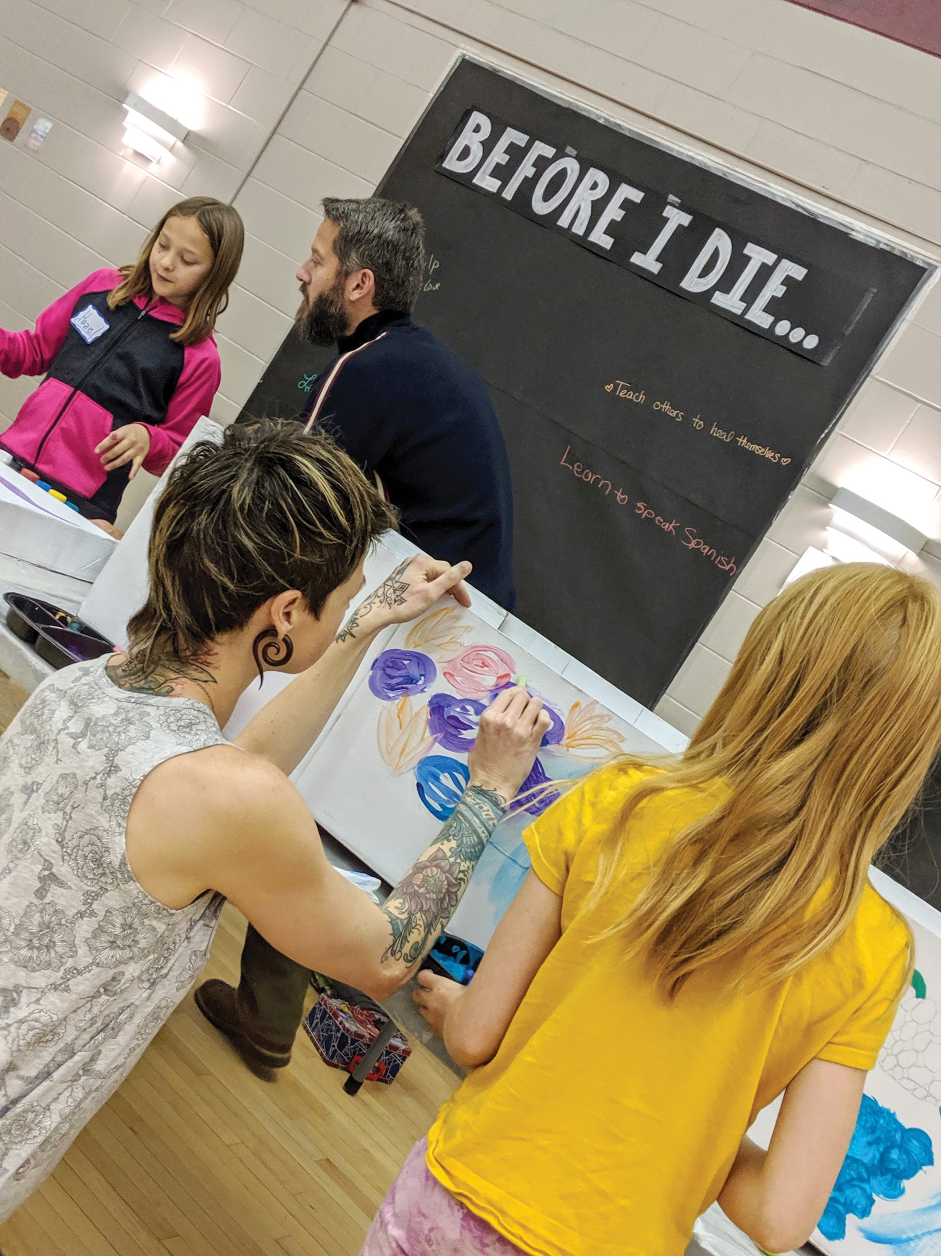 Visitors to the Deathcare Expo, including kids, were able to personalize a cardboard casket with paint and try their hand at building a grief mandala. ?