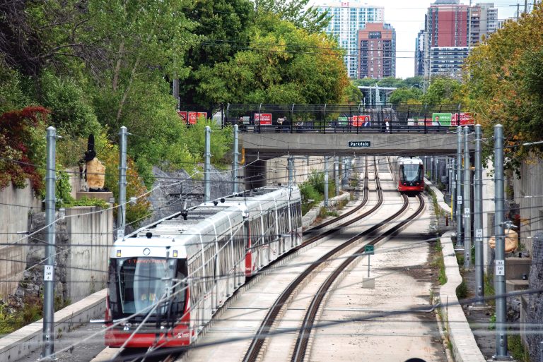 New light rail trains arrive at Tunney's Pasture station|A short article with a mention of the Rolls Royce from the Ottawa Journal