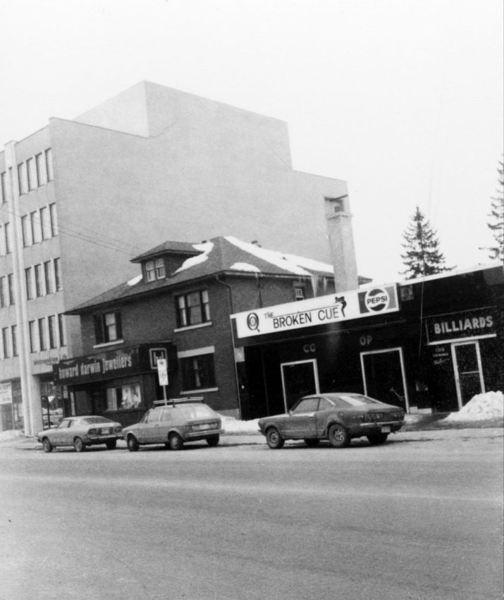 The exterior of the old pool hall seen in a black and white photo. 