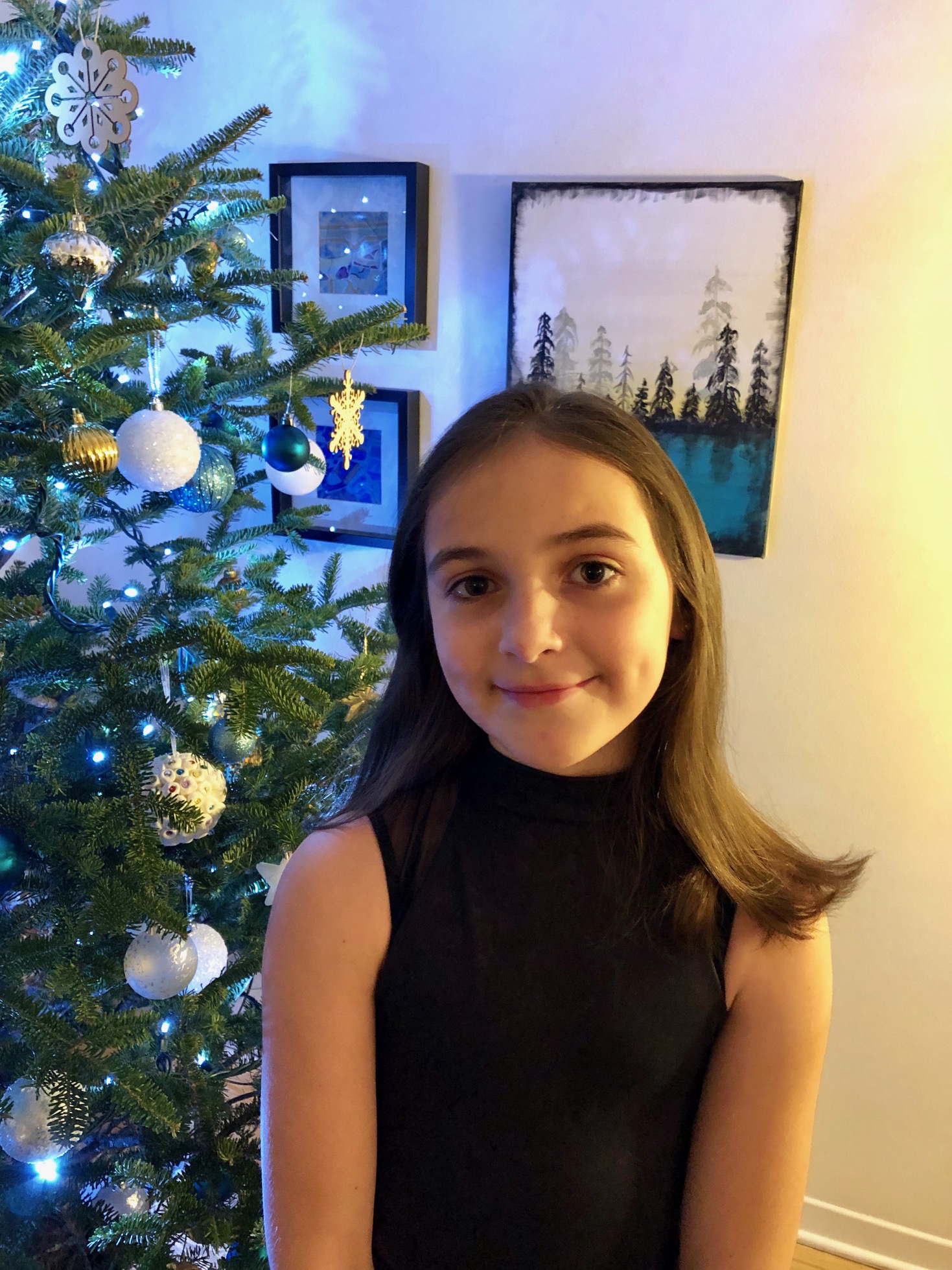 10-year-old Maisie Burchett, who will play one of the chipmunks in this year’s performance of Ballet Jörgen’ The Nutcracker: A Canadian Tradition at the Shenkman Arts Centre, poses in front of her family's christmas tree.