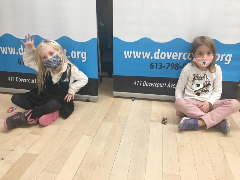 Two children in masks sit in a Dovercourt class in November.