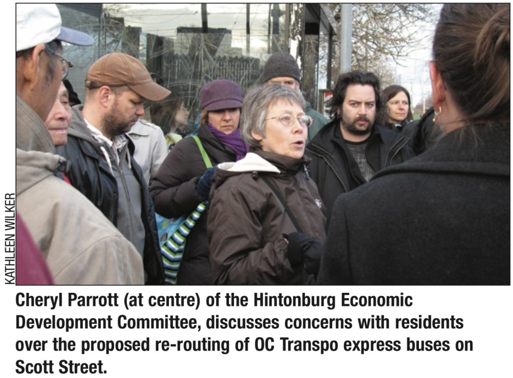 Cheryl Pareot speaks with other people outside. 