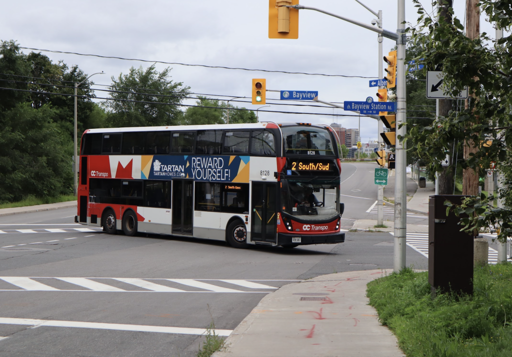 A double decker bus turns down Bayview. 