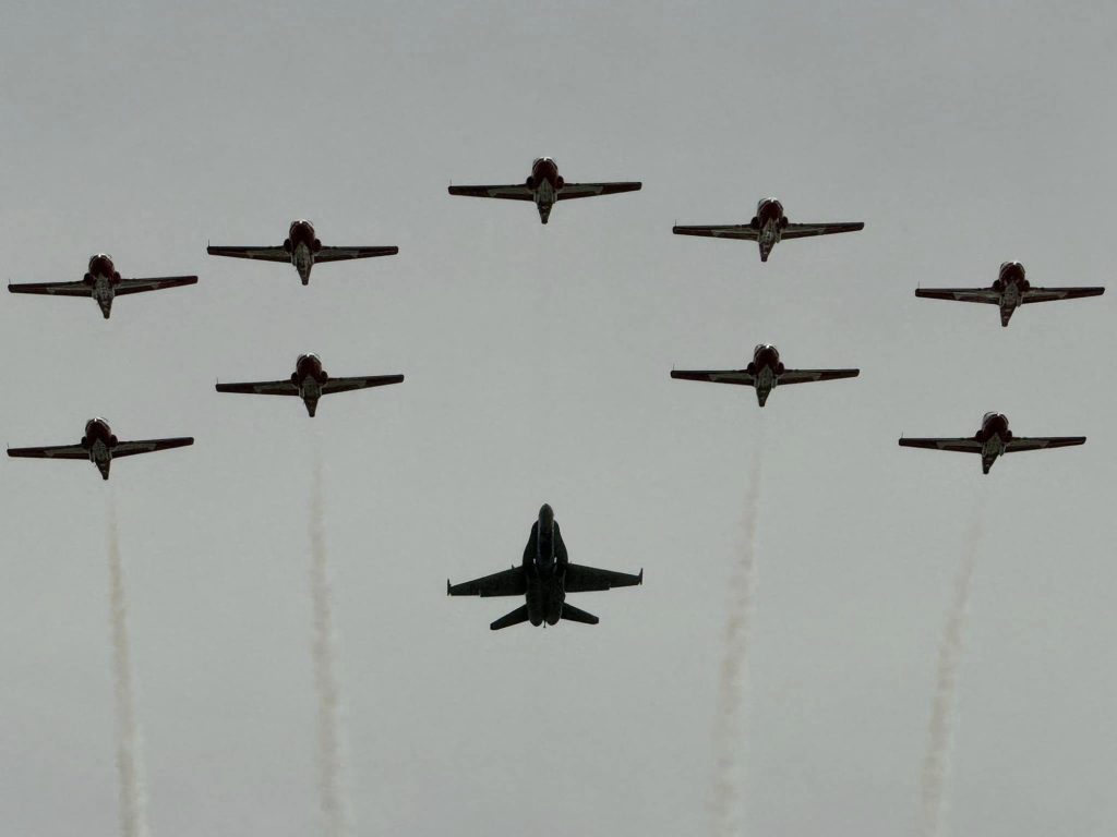 Ten aircraft fly in the skies over Ottawa. 