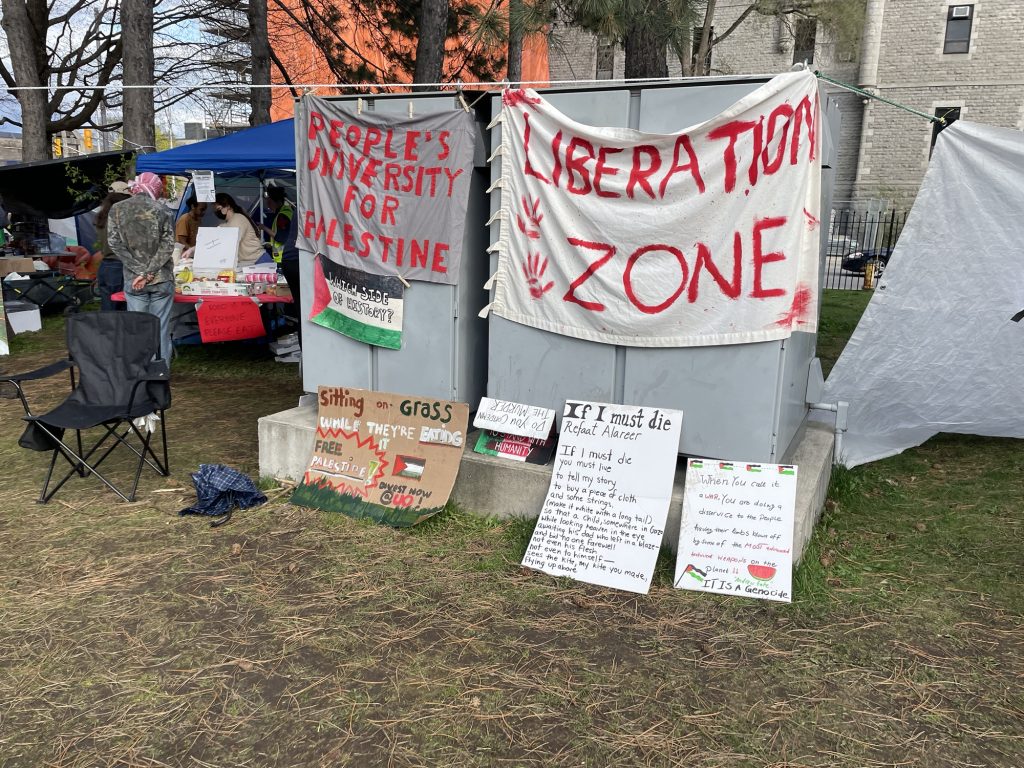 Signs and banners are hung in two large boxes. 