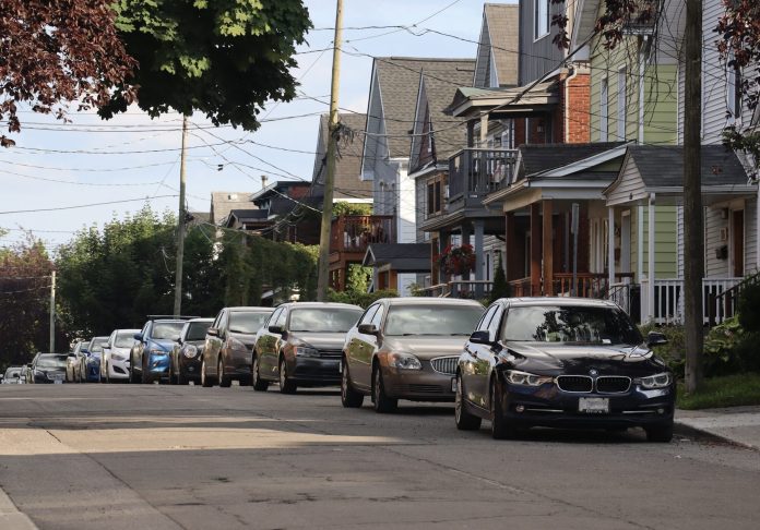 Community members are concerned more people will park on Kitchissippi side streets after paid parking is implemented in 2025. Photo by Charlie Senack.