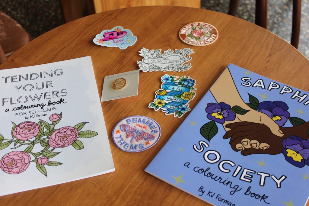 Stickers and colouring books on a table. 