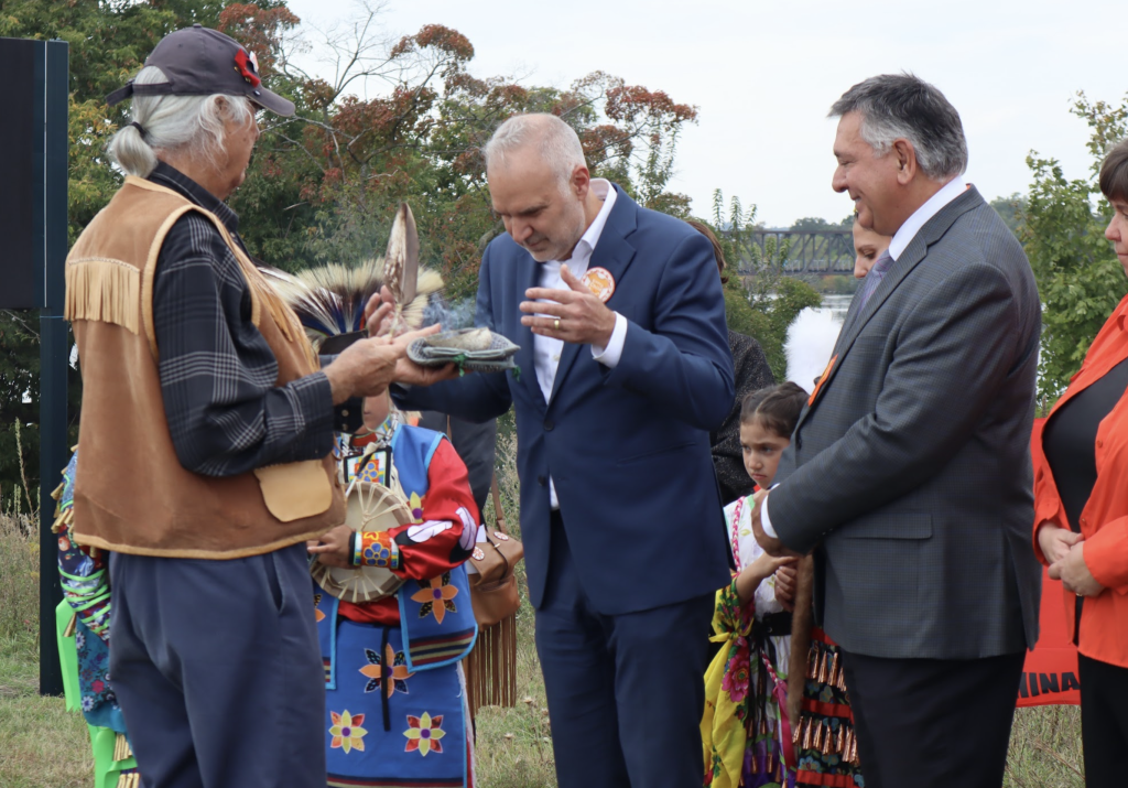 Toby is smudged by an Indigenous elder. 