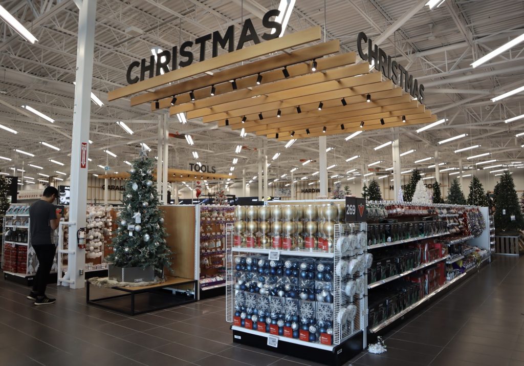 The Christmas section at Carlingwood’s new Canadian Tire. Shelves are stocked with ornaments and Christmas trees can be seen in the background.