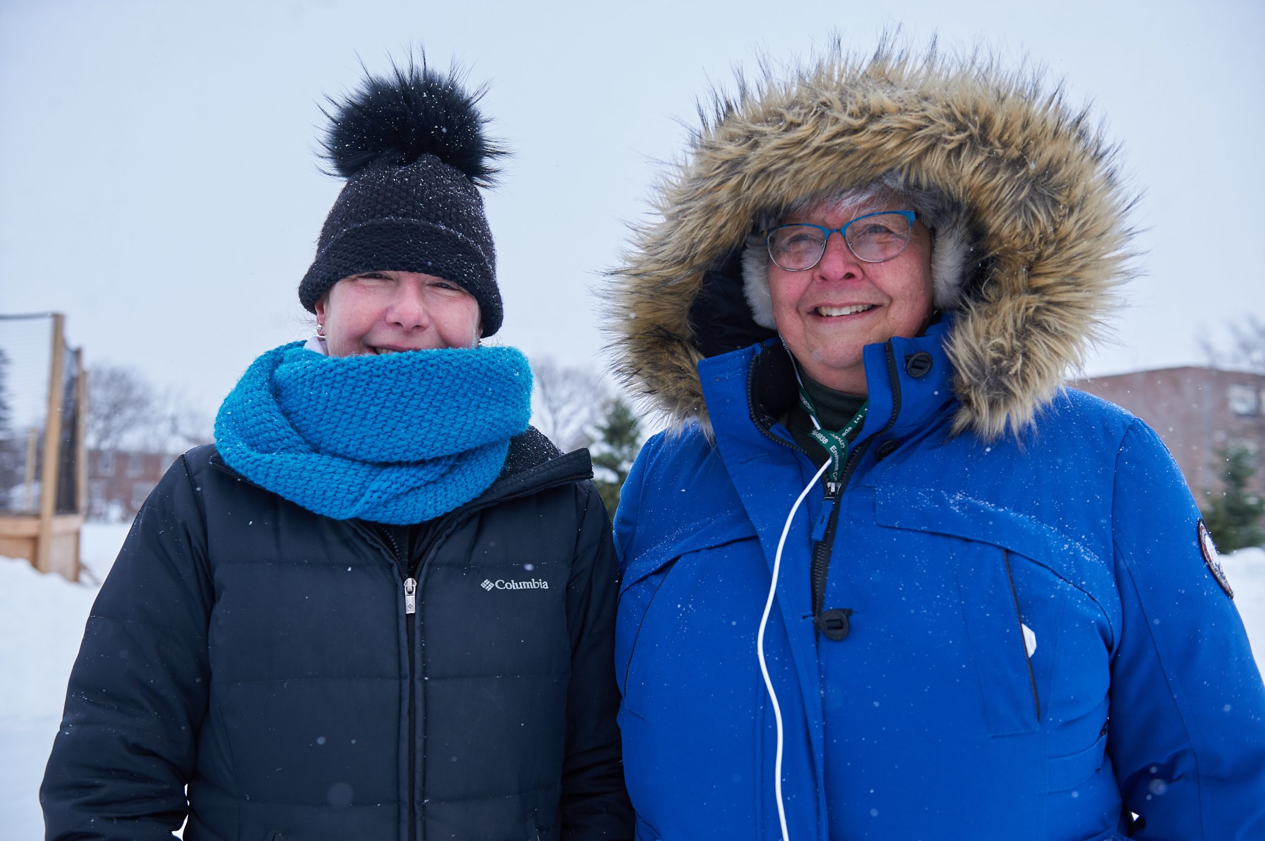 Tracelyn Watchorn and Anita Maasland pose for a photograph. They are wearing heavy black and blue winter jackets.