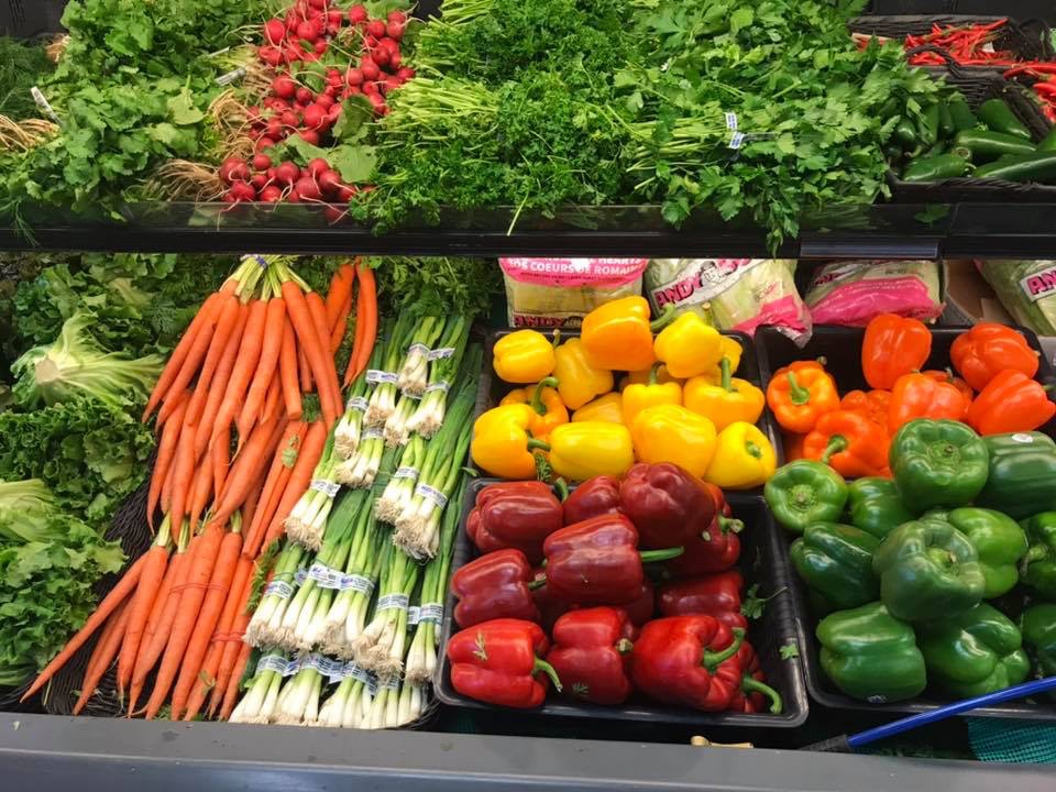 Carrots, peppers and other fresh vegetables on display. 