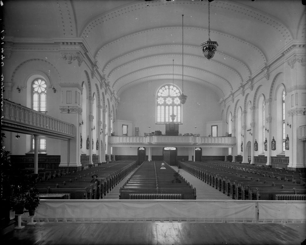 An old black and white photo showing the inside of the church. 