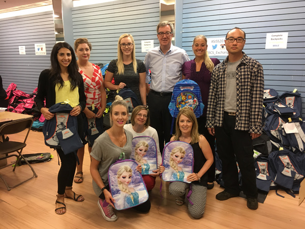 A team of-volunteers from service coordination for people with developmental disabilities pose with Mayor Jim Watson.