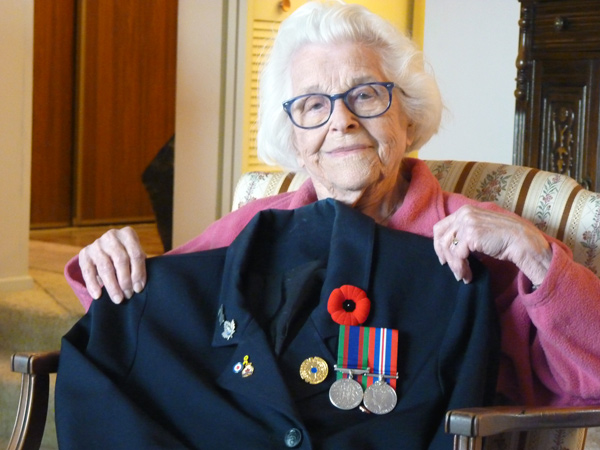 Elsa Lessard with her uniform and medals earned during World War II. Photo by Judith van Berkom