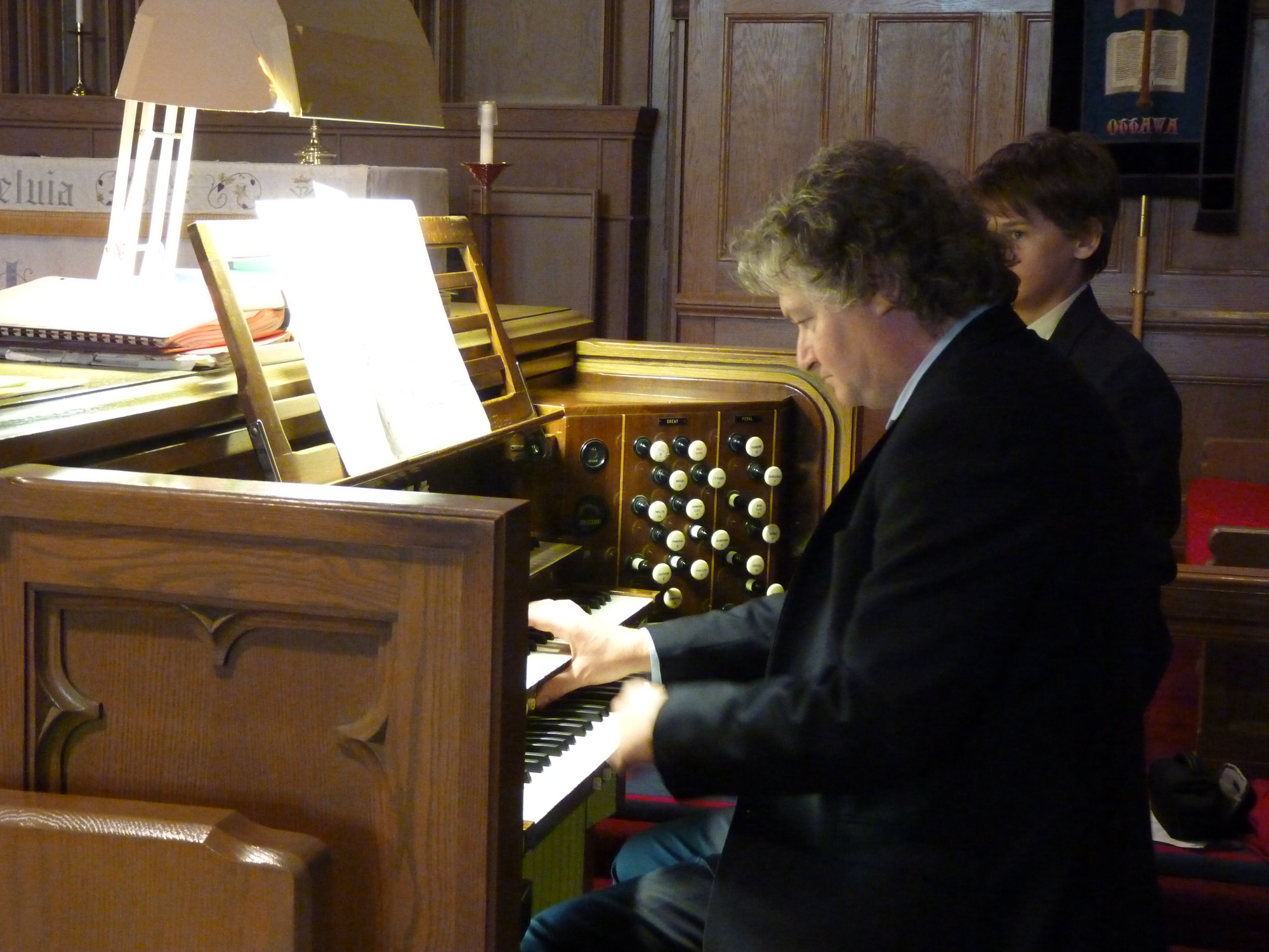 Matthew Larkin playing the Casavant organ at the November 22 recital at St. Matthias Church. Photo by Judith van Berkom