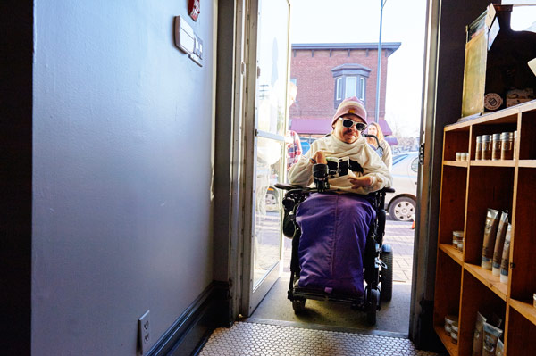 Chris Binkowski from Accessibility for Humanity tries out the new ramp at House of Barons. Photo by Ellen Bond