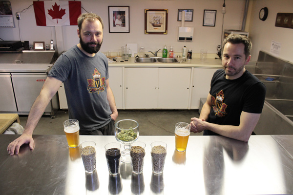 Mike and Kevin Sirko showcase the grains and hops that go into making their beer. Photo by Jacob Hoytema