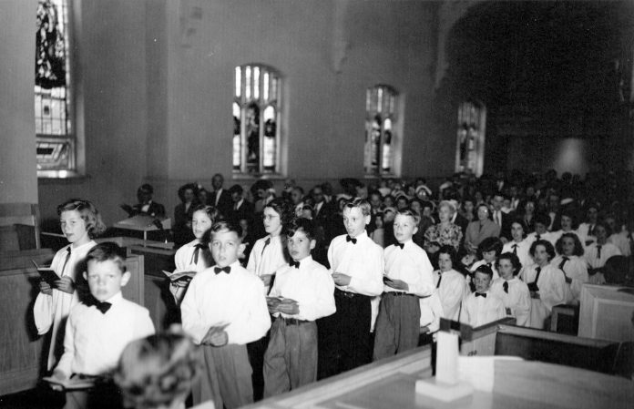 This archival photo is of a processional of the WUC Junior Choir in 1954. Now Bluesfest and Dovercourt will be bringing music back to this building in a new way. Photo courtesy of Kitchissippi United.|Wellington West’s Keith McCuaig will be teaching guitar and ukulele classes at the Bluesfest School of Music and Art. Photo by Anita Grace.