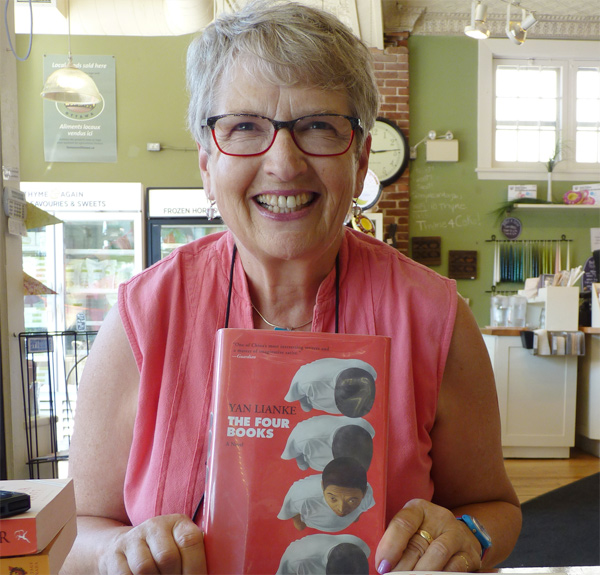 Barbara Clubb, former chief librarian of the Ottawa Public Library, with some of the books on her summer reading list. Photo by Judith van Berkom