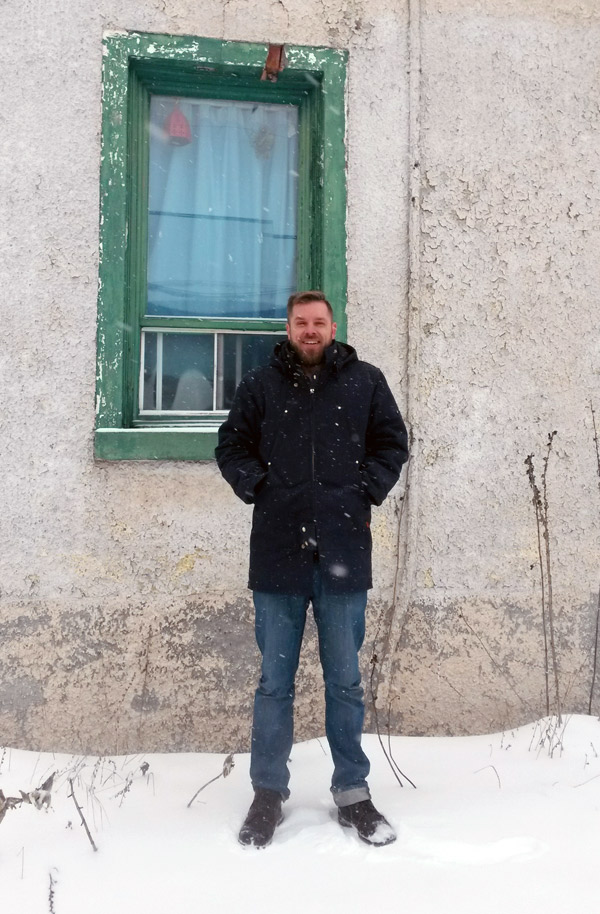 David Segaert stands next to one of his favourite houses on Armstrong Street. “The house is falling apart but it makes for by far the most interesting pictures. I’ve never actually seen anyone going in and out of there,” he says. Photo by Bradley Turcotte