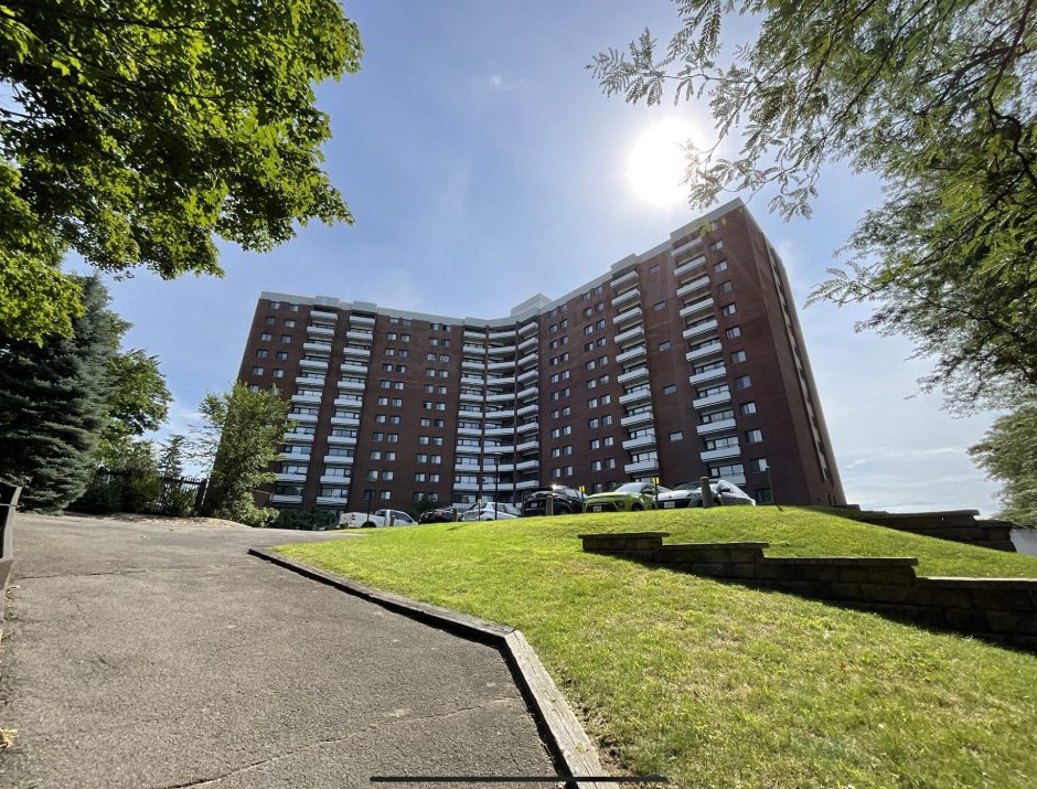 The exterior of a condo building. 