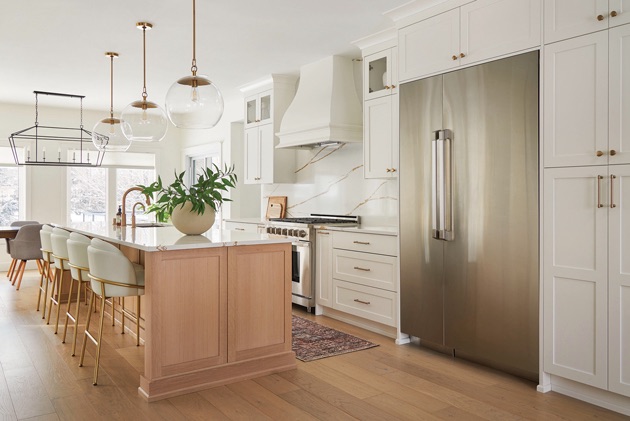 The exterior of a bright kitchen that is mostly white.